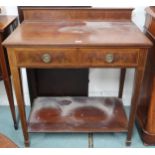A late Victorian mahogany buffet table with two drawers on square tapering supports joined by