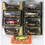 Nine assorted 1:18 scale Burago die-cast model cars, including a Diamond Collection Smart