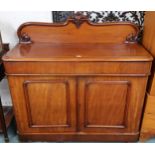 A Victorian mahogany sideboard with carved backsplash over single long drawer over pair of panel