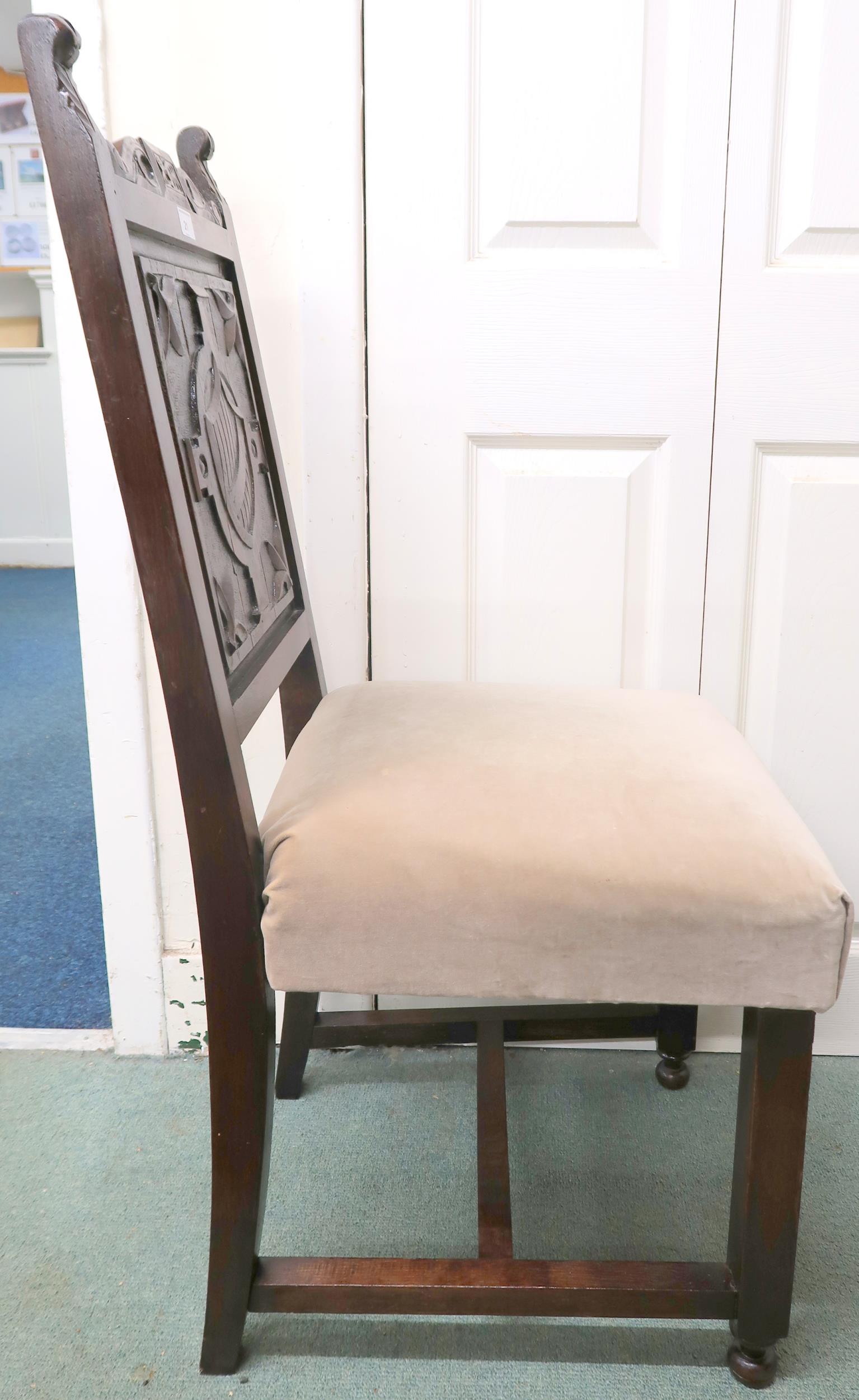 A 19th century oak hall chair with solid panel splat carved with shield over upholstered seat on - Image 2 of 2