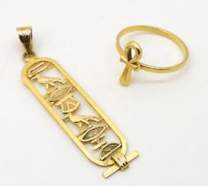 An Arabic gold hieroglyph pendant, together with an Arabic gold Ankh ring size P1/2, weight together