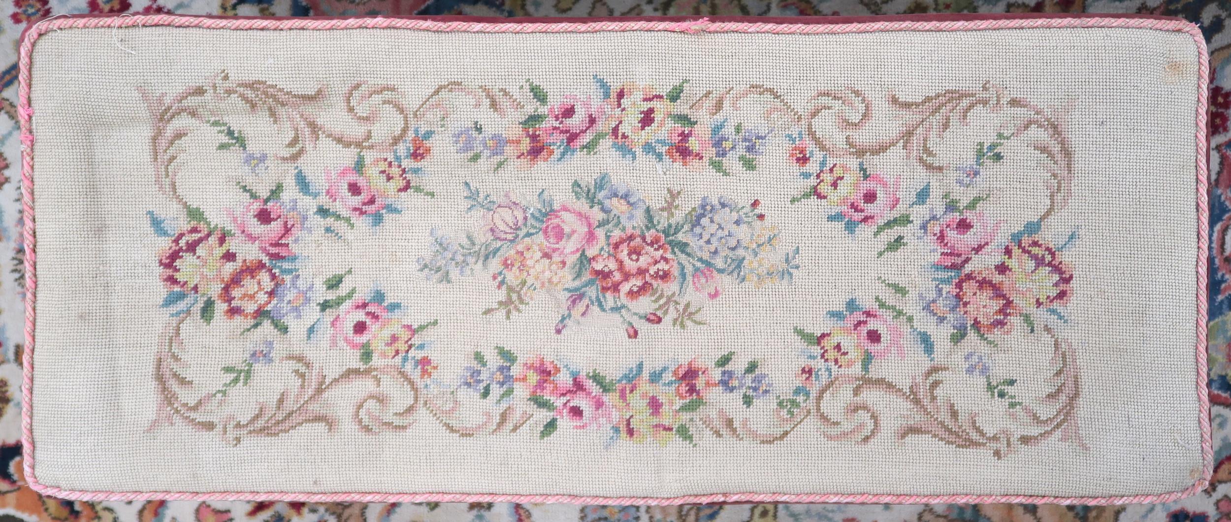 A Victorian floral tapestry upholstered piano stool on square tapering supports, 45cm high x 92cm - Image 2 of 2