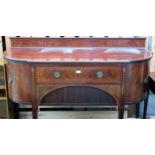 A 19th century mahogany sideboard with central long drawers flanked by bowed cabinet doors on square