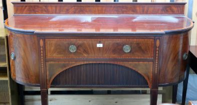 A 19th century mahogany sideboard with central long drawers flanked by bowed cabinet doors on square