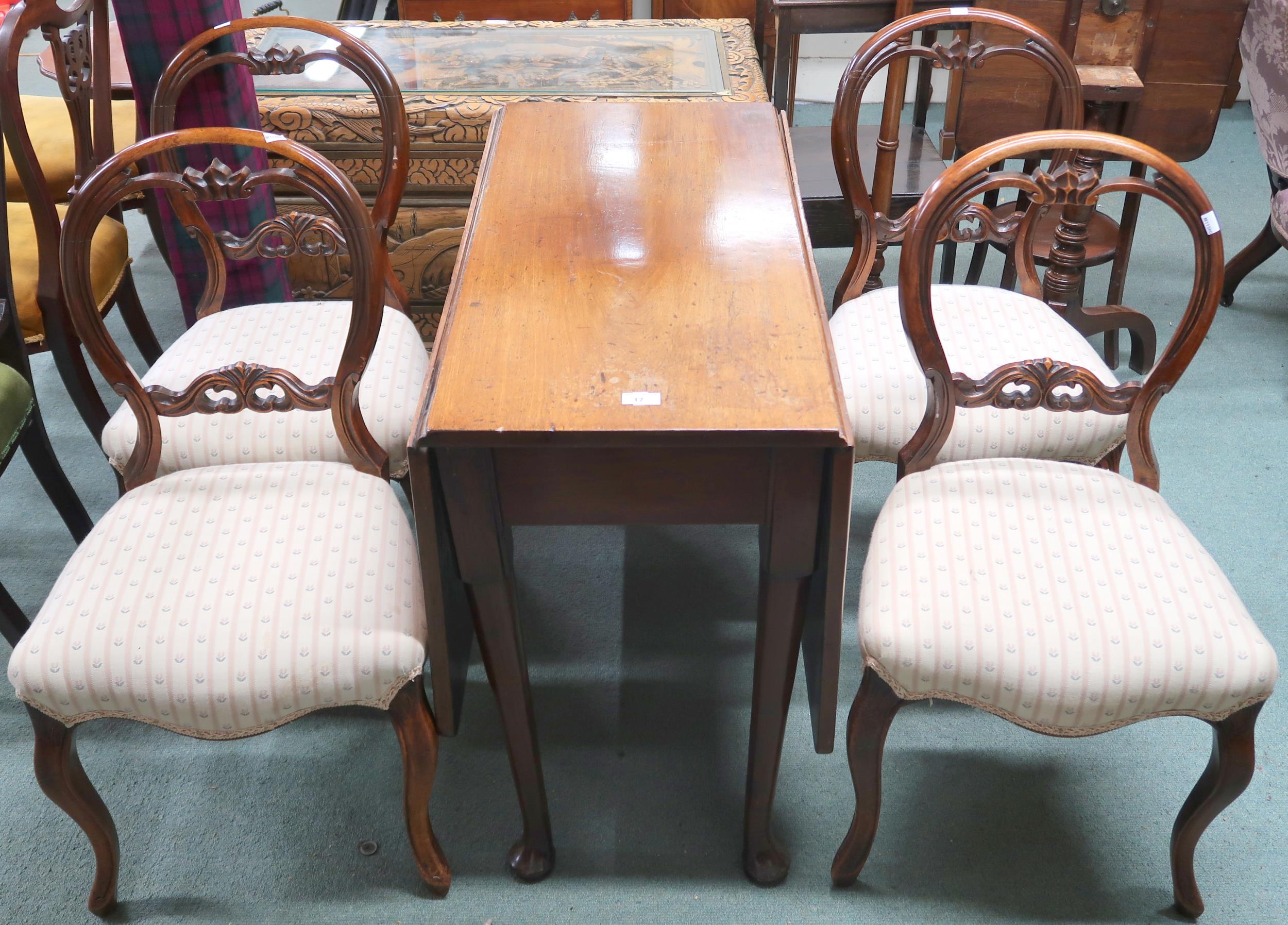 A set of four Victorian walnut framed balloon back parlour chairs on cabriole supports and a