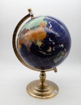 A large blue ground hardstone globe of the world on gilt metal stand Condition Report:Available upon