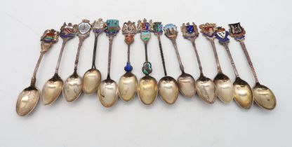 A collection of silver and guilloche enamel souvenir spoons, 200gms (13) Condition Report: