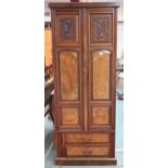 A Victorian mahogany and burr walnut veneered hall robe with two panel doors over two long drawers