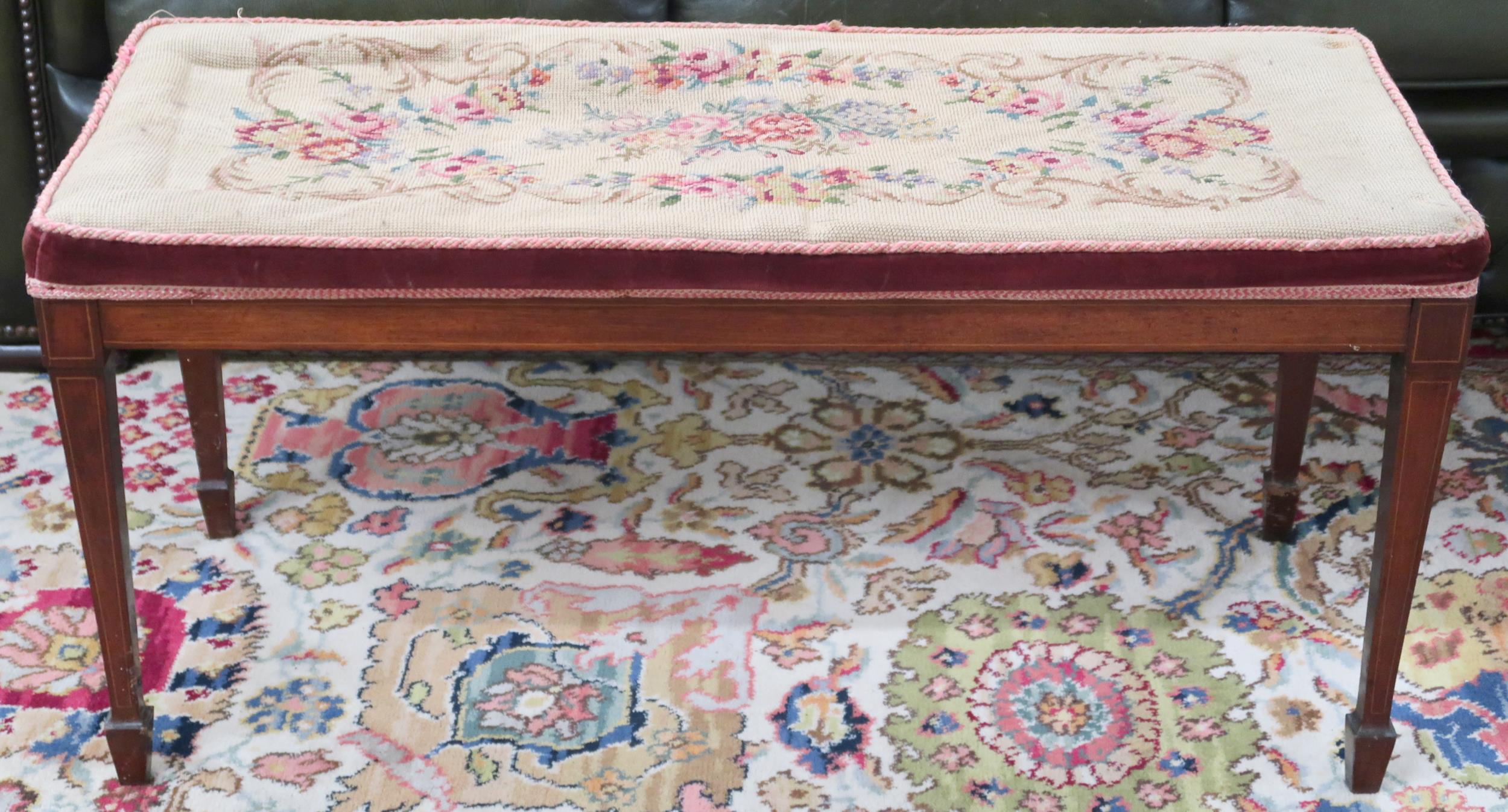 A Victorian floral tapestry upholstered piano stool on square tapering supports, 45cm high x 92cm