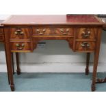 A 19th century mahogany low boy style desk with red skiver over central drawer flanked by two
