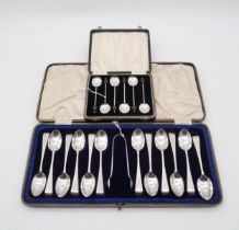 A cased set of silver Old English pattern tea spoons and sugar tongs, maker's mark NS, engraved with