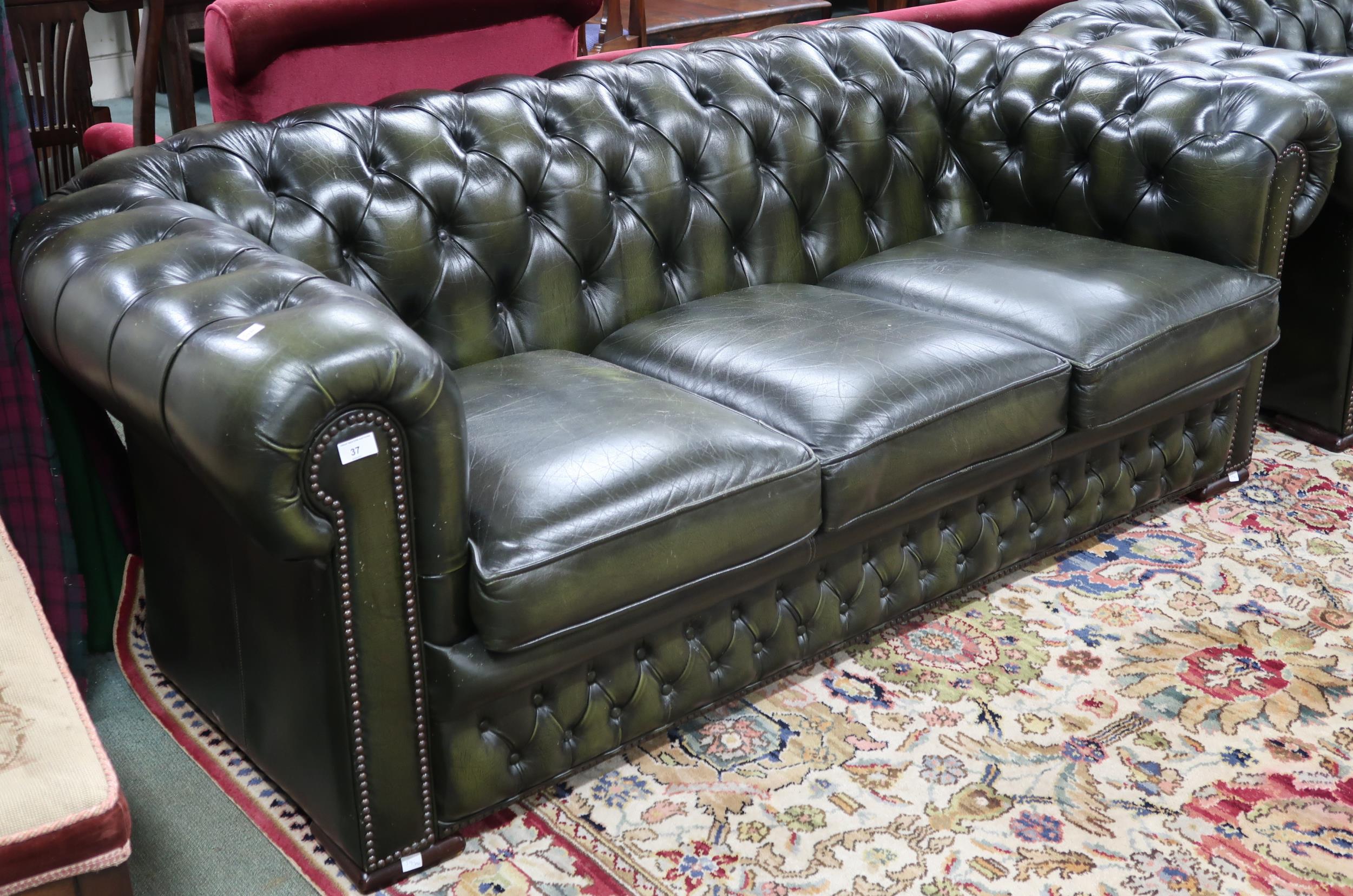 A 20th century forest green leather buttonback upholstered Chesterfield style three seater club - Image 2 of 2