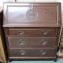 A 20th century Chinese hardwood bureau with fall front writing compartment over three drawers, 110cm