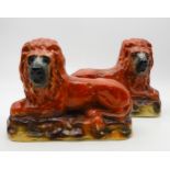 A pair of Bo'Ness style pottery lions with glass eyes Condition Report:Available upon request