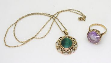 A 9ct gold malachite pendant, diameter 2.3cm, length of chain 46cm, together with a yellow metal