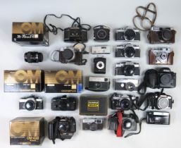 An extensive array of vintage cameras, to include a selection of Olympus OM series models, with