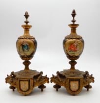 A pair of garniture urns with classical decoration Condition Report:Available upon request