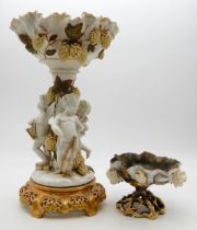 A Moore' pottery cherub centrepiece together with a small bowl Condition Report:Available upon