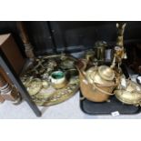 A collection of brass and gilt metal items including two miners lamps, large wall chargers, etc