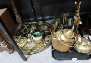 A collection of brass and gilt metal items including two miners lamps, large wall chargers, etc