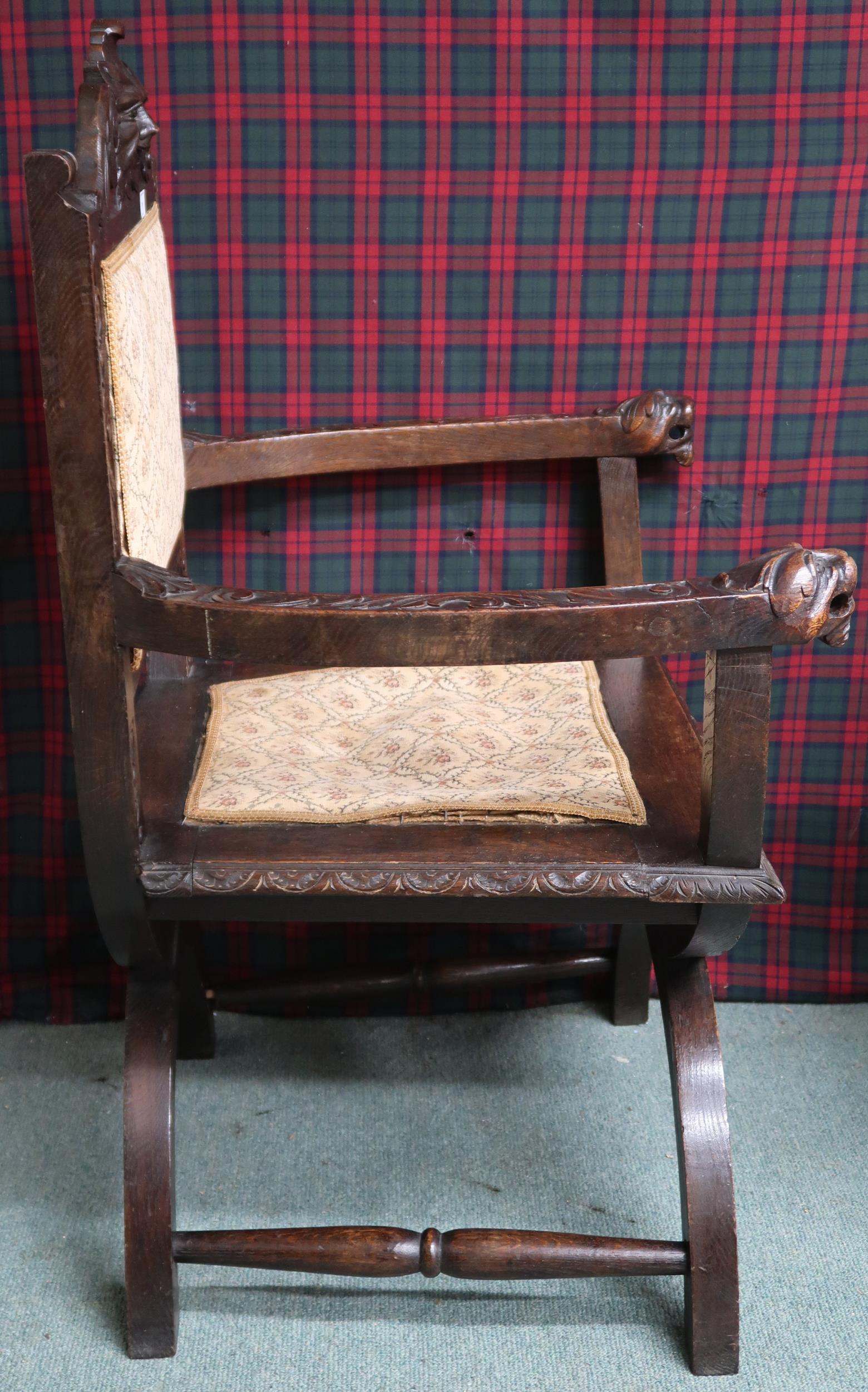 A Victorian oak Gothic revival hall armchair with upholstered splat carved with green man masque - Image 2 of 2