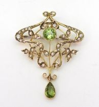 A 9ct gold peridot and pearl Edwardian pendant brooch, length 4.2cm, weight 3.8gms Condition