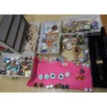 A four drawer jewellery box full of vintage costume jewellery to include a Karl Lagerfeld watch