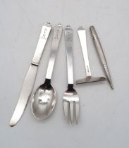 Georg Jensen; a silver Christening set, in the pyramid pattern, monogrammed RYH 1931, with London