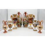 A pair of continental porcelain urns painted with couples, a smaller pair of urns, a pair of