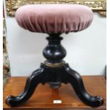 A Victorian adjustable piano stool with pink velour seat cover on ebonised tripod base, 47cm high