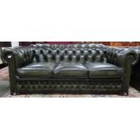 A 20th century forest green leather buttonback upholstered Chesterfield style three seater club