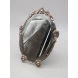 A Portuguese silver mounted oval mirror, Porto, 1938-1984, 916 fineness, the mount decorated with