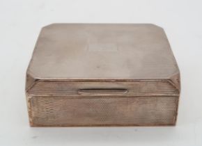 A George V silver cigarette box, by E N Speak, Birmingham 1931, of canted rectangular form, the body