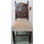 A 19th century oak hall chair with solid panel splat carved with shield over upholstered seat on