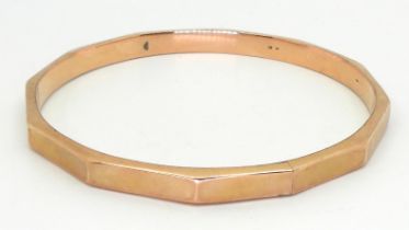A 9ct gold faceted bangle, inner diameter 7.2cm, weight 11.4gms Condition Report:Available upon