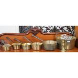 A lot of brass ware to include jelly pan, five assorted saucepans and a candlestick (7) Condition