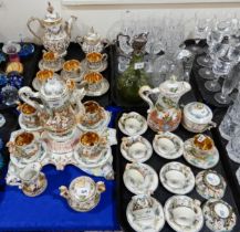 A Capodimonte coffee set on stand comprising four cups and saucers, coffee pot, cream and sugar,