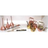 A mixed lot of copper and brass wares to include copper funnels, kettles, plate candle snips etc