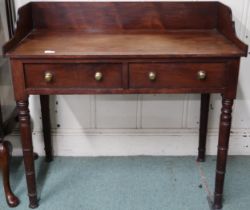 A 19th century mahogany two drawer wash stand with gallery back on turned supports, 87cm high x 93cm