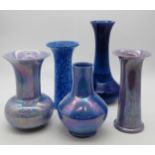 A collection of Ruskin pottery vases including a mottled glaze example dated 1930, 25cm high, a