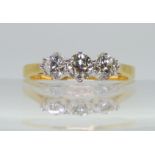 A CLASSIC THREE STONE DIAMOND RING the 18ct yellow and white gold mount set with estimated approx