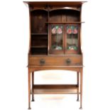 A GLASGOW STYLE SIDE CABINET  with cornice top over pierced aprons over asymmetrical open shelves
