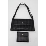 A GIANNI VERSACE BLACK LEATHER PINSTRIPE BAG with dust bag, length 30cm x height 15cm x width 5cm,