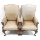 A PAIR OF 20TH CENTURY LEATHER UPHOLSTERED REPRODUCTION ARMCHAIRS  with mahogany frame on scrolled