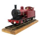 A 3 1/2"-GAUGE LIVE STEAM COAL-FIRED 0-4-2 LOCOMOTIVE Named Tracy, in deep red and pink livery,