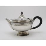 A GEORGE V SILVER TEAPOT by Roberts & Belk, Sheffield 1922, of squat circular form, with a band of