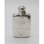 A GEORGE V SILVER HIP FLASK by Cohen & Charles, Chester 1920, with a hinged bayonet cap and a