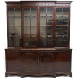 AN EARLY 20TH CENTURY MAHOGANY BREAKFRONT BOOKCASE  with moulded cornice over pair of beaded