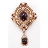 A GARNET AND PEARL PENDANT BROOCH mounted in 9ct gold, in a Renaissance style. Length of pendant