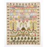 A VICTORIAN NEEDLEWORK SAMPLER Dated 1885, unmounted and unusually well-preserved, the field